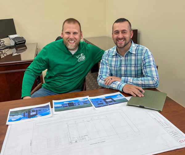 Brent Kattau & Joel Lederman reviewing plans for Elevation Park Model Company plant.